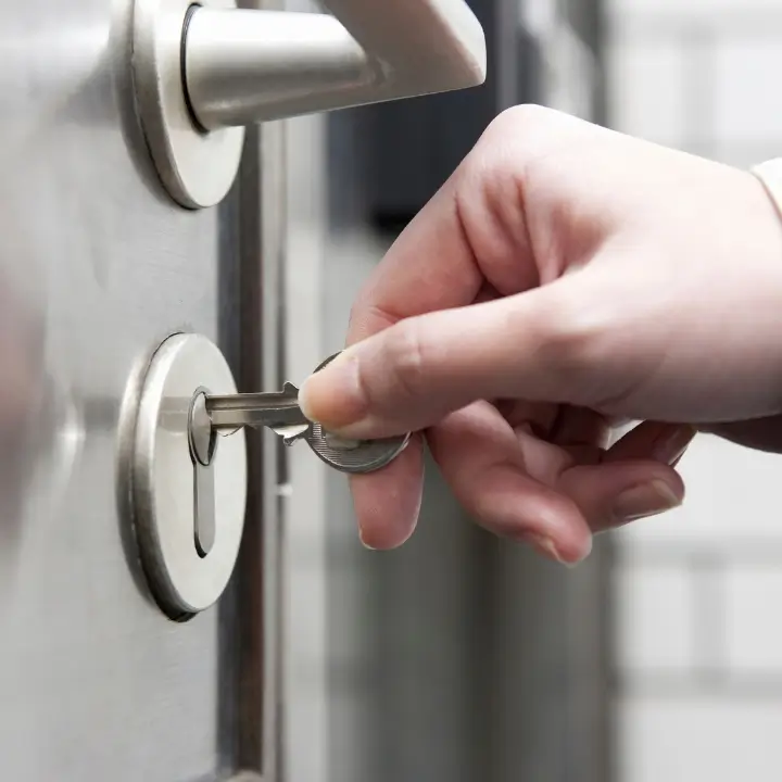 Inserting a key into the door lock