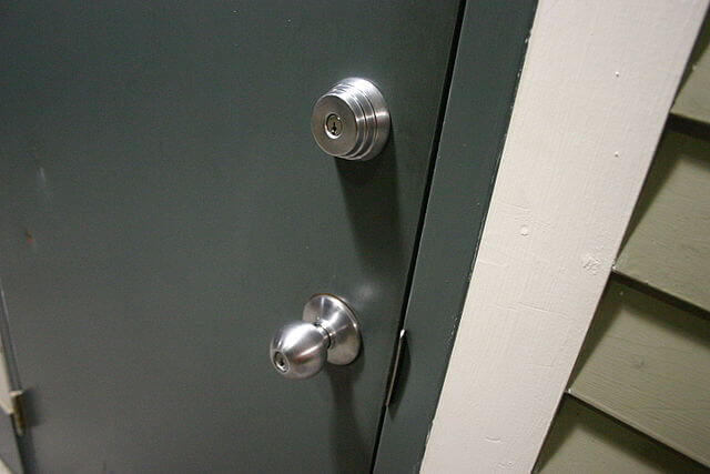 Door with two locks, one in the doorknob and a separate deadbolt